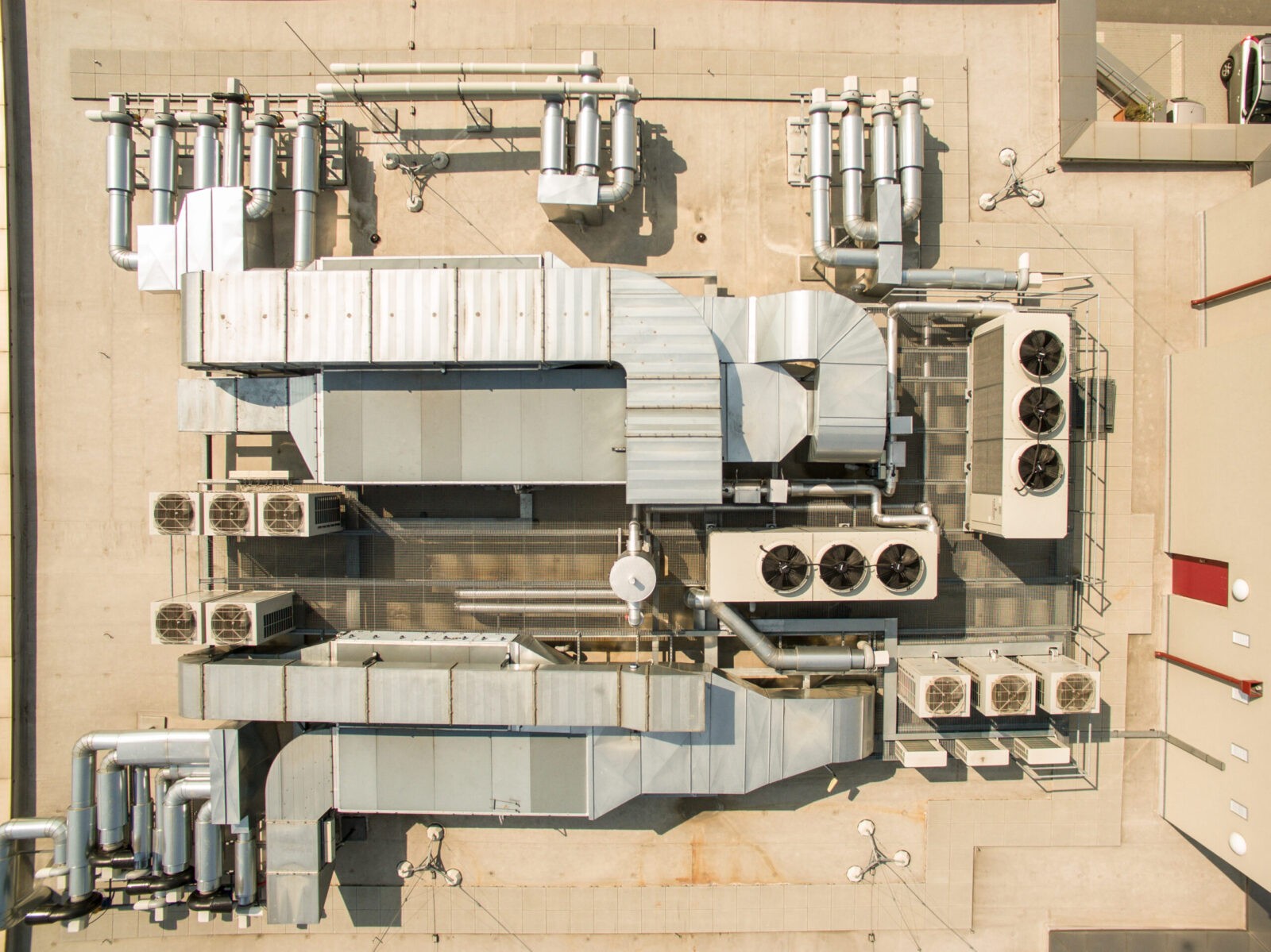 Aerial view of industrial HVAC units on a rooftop.
